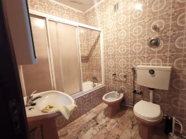 Sink toilet bidet shower bathtub tiled bathroom at Double Bedroom close to Minho University 3 in Guimaraes Student Accommodation