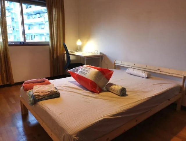 Bed desk chair and laundry bedroom at Double Bedroom close to Minho University 3 in Guimaraes Student Accommodation