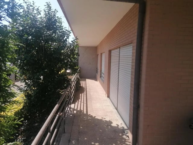 Balcony with railing and green trees exterior at Classic Single Bedroom close to João de Deus Metro Station in Vila Nova De Gaia Student Accommodation