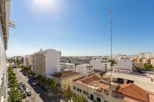 City view from balcony overlooking buildings and street exterior at Neat 2-bedroom flat in Olhão in Faro Student Accommodation