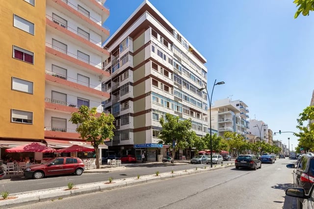 Apartment buildings with balconies and street view exterior at Neat 2-bedroom flat in Olhão in Faro Student Accommodation