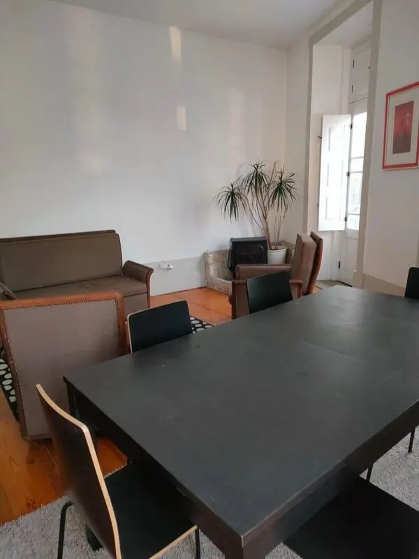Sofa chairs dining table plants living room at Nice double bedroom in Ponte de Lima in Viana Do Castelo Student Accommodation