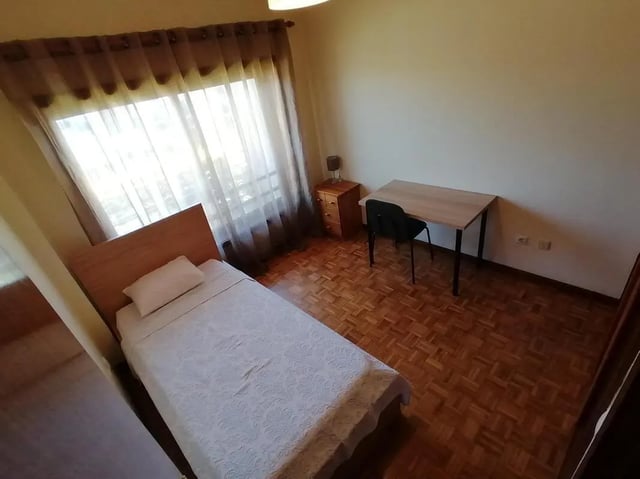Beds desk and nightstand in student bedroom Bedroom at Classic Single Bedroom close to João de Deus Metro Station in Vila Nova De Gaia Student Accommodation