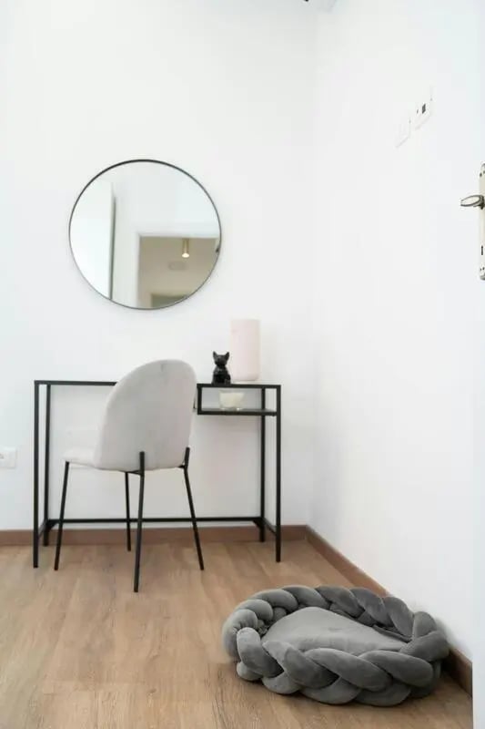 Desk chair round mirror pet bed study area at Excellent 1-bedroom apartment near Pescara Centrale in Pescara Student Accommodation