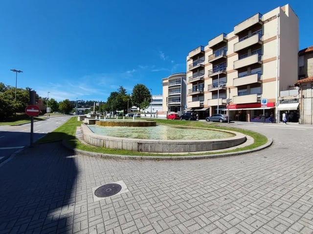 Fountain and apartment building exterior at Double Bedroom close to Minho University 7 in Guimaraes Student Accommodation
