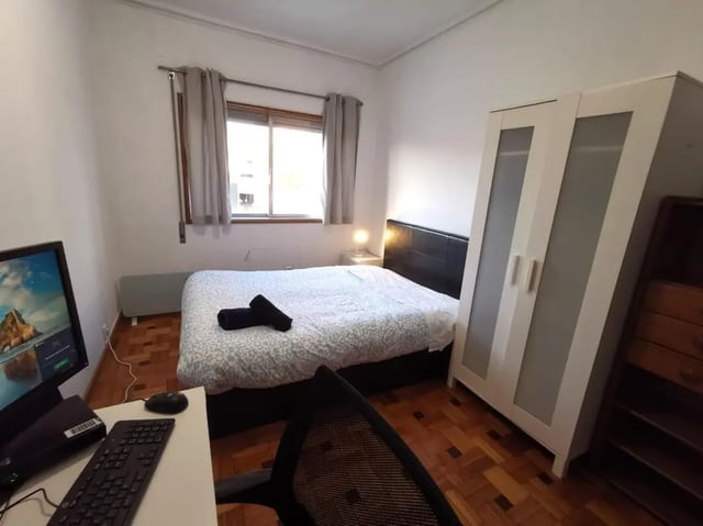 Bed computer wardrobe and desk bedroom at Double Bedroom close to Minho University 7 in Guimaraes Student Accommodation