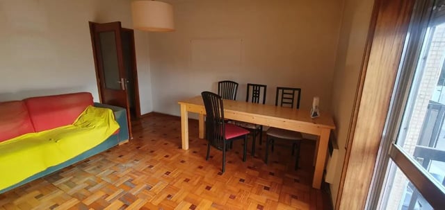 Sofa dining table and chairs living room at Double Bedroom close to Minho University 7 in Guimaraes Student Accommodation