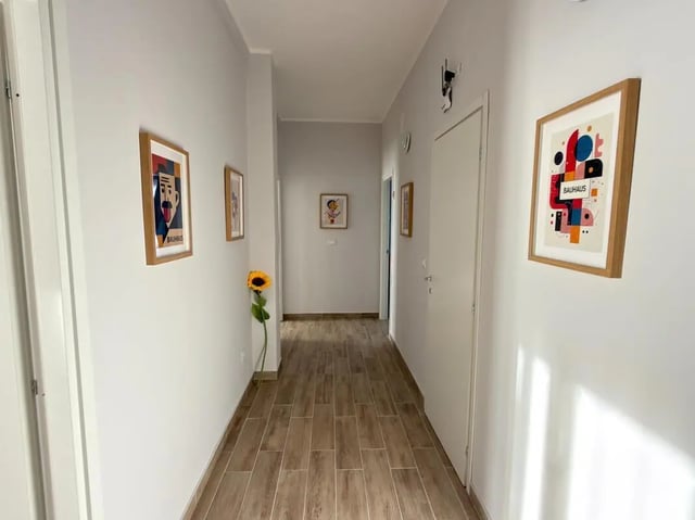 Hallway with artwork and sunflower hallway at Amazing bedroom in Pescara in Pescara Student Accommodation