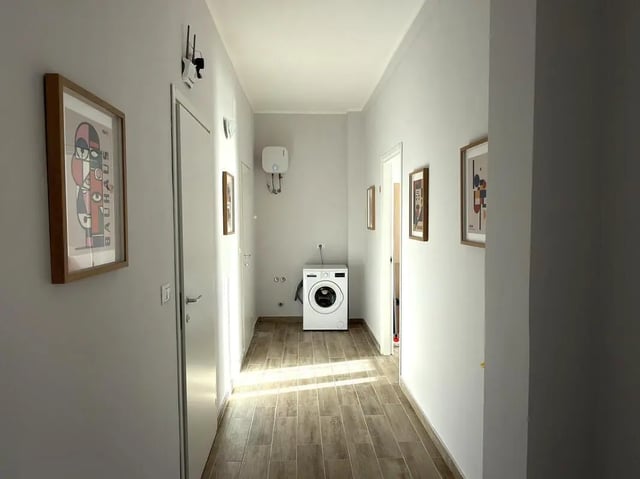 Washing machine on tiled floor hallway hallway at Amazing bedroom in Pescara in Pescara Student Accommodation