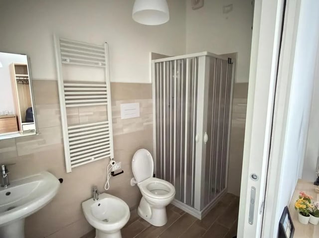 Sink bidet toilet shower radiator bathroom at Amazing bedroom in Pescara in Pescara Student Accommodation