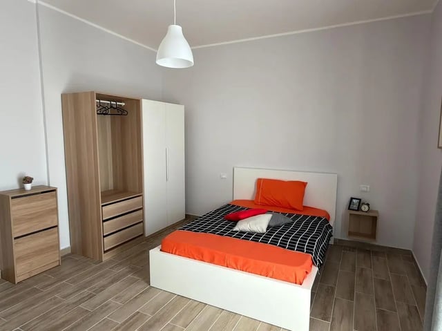 Wardrobe bed nightstand with decor bedroom at Amazing bedroom in Pescara in Pescara Student Accommodation