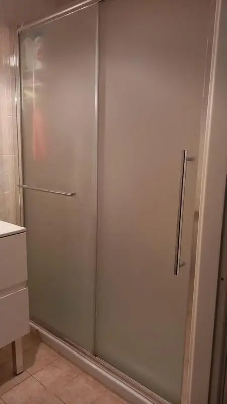 Frosted sliding glass shower doors silver handle Bathroom at Comfy 3 bedroom apartment close to University of Parma in Parma Student Accommodation