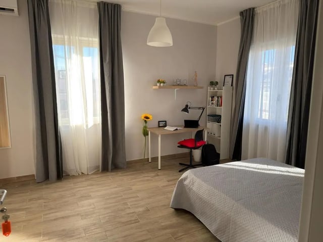 Bed desk chair and bookshelf bedroom at Amazing bedroom in Pescara in Pescara Student Accommodation