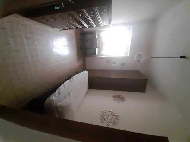 Bed dresser and window student accommodation bedroom at Single bedroom close to Università degli Studi Mediterranea di Reggio Calabria in Reggio Calabria Student Accommodation
