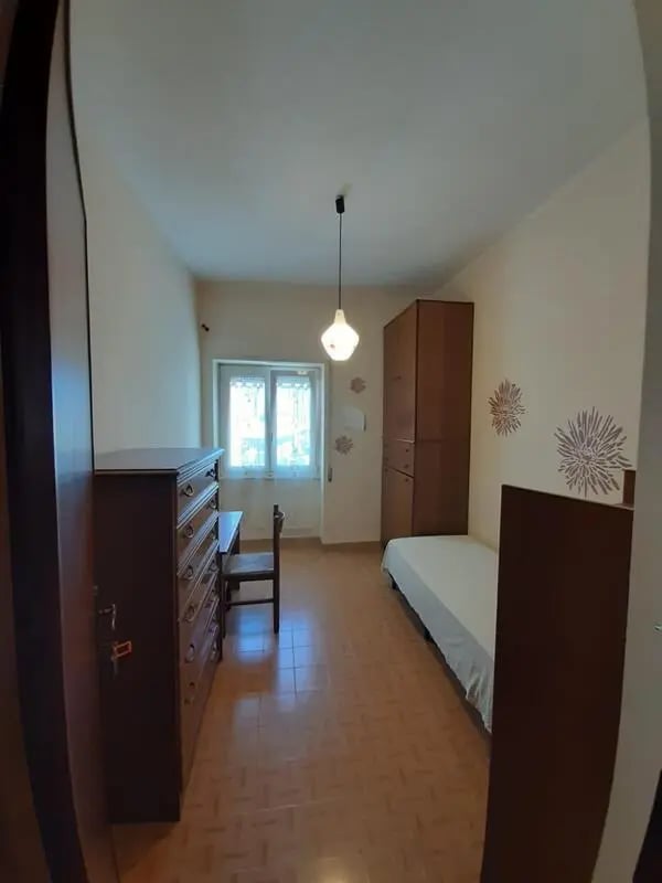 Chest of drawers desk chair bed wardrobe bedroom at Comfy single bedroom near Università degli Studi Mediterranea di Reggio Calabria in Reggio Calabria Student Accommodation