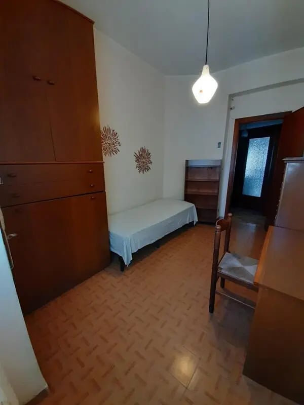 Wardrobe bed chair desk shelf Bedroom at Comfy single bedroom near Università degli Studi Mediterranea di Reggio Calabria in Reggio Calabria Student Accommodation