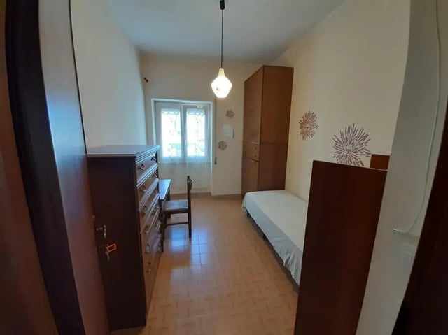 Dresser bed wardrobe and desk bedroom at Comfy single bedroom near Università degli Studi Mediterranea di Reggio Calabria in Reggio Calabria Student Accommodation