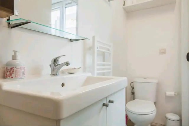 Sink soap dispenser towel rack toilet bathroom at Very cosy studio in Berchem in Antwerp Student Accommodation