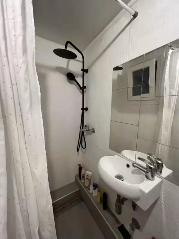 Shower sink mirror and toiletries bathroom at Homely Double Bedroom with a balcony close to Aristotelous Square in Thessaloniki Student Accommodation