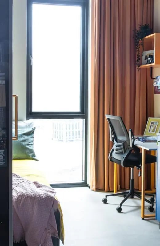 Bed desk chair curtains and shelving unit bedroom at Cool single ensuite bedroom close to Aarhus Universitet in Aarhus Student Accommodation