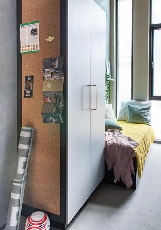 Corkboard posters rolled mat and soccer ball bedroom at Cool single ensuite bedroom close to Aarhus Universitet in Aarhus Student Accommodation