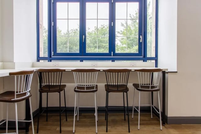 Bar stools at counter by blue window study area at Ben Russell Court in Leicester Student Accommodation