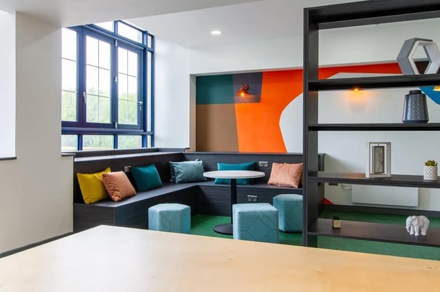 Bench seating with colourful cushions and blue ottomans common area at Ben Russell Court in Leicester Student Accommodation