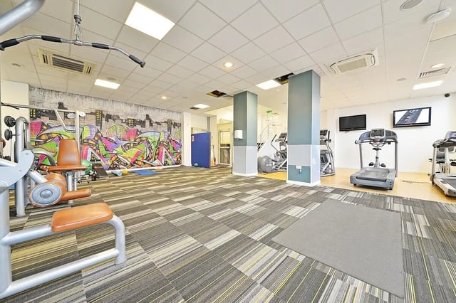 Gym equipment with graffiti wall and treadmills gym at Canalside in Birmingham Student Accommodation