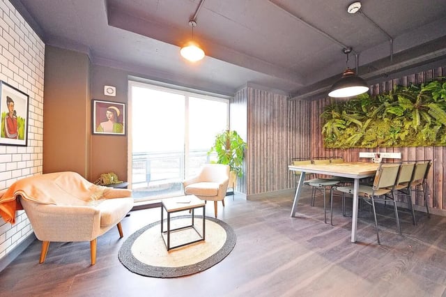 Armchairs coffee table dining table living room at Canalside in Birmingham Student Accommodation
