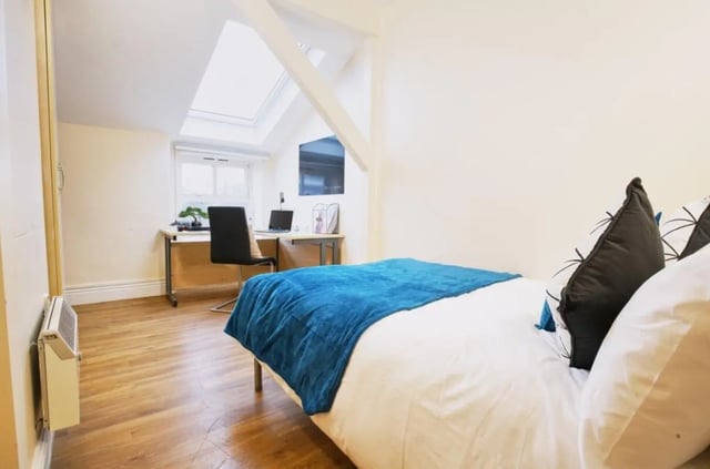 Bed desk chair laptop skylight bedroom at Daisybank Villas in Manchester Student Accommodation