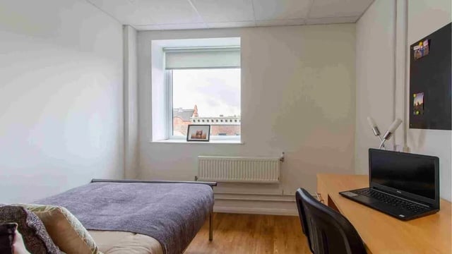 Bed desk laptop and window bedroom at Danesgate House in Lincoln Student Accommodation