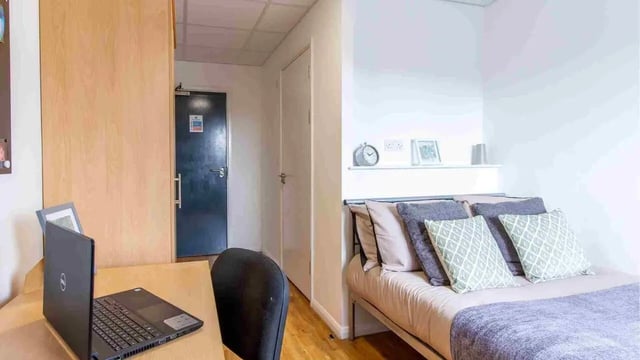 Bed desk and closet student accommodation bedroom at Danesgate House in Lincoln Student Accommodation
