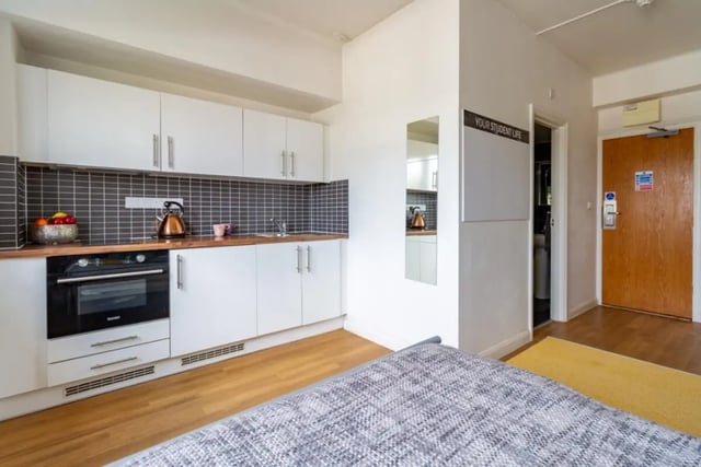 Compact kitchen with oven sink kettle and cabinets kitchen at Portobello Garrow House in London Student Accommodation
