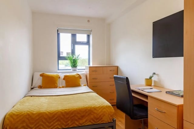 Bed desk chest of drawers television bedroom at Surrey Quays Landale House in London Student Accommodation