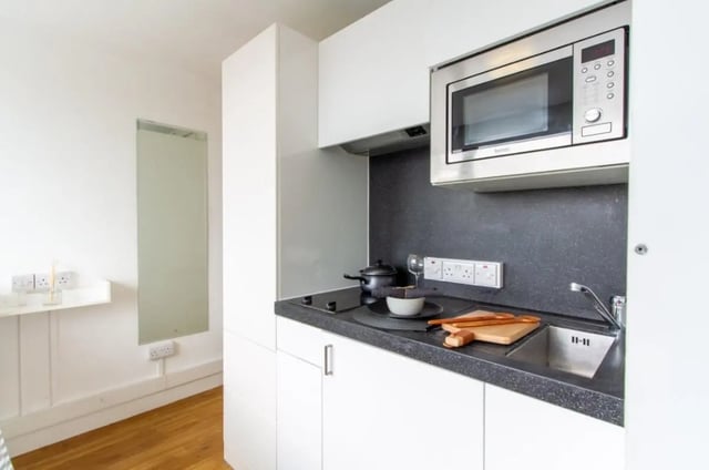 Kitchenette with microwave induction hob sink kitchen area at Chelsea Lightfoot Hall in London Student Accommodation