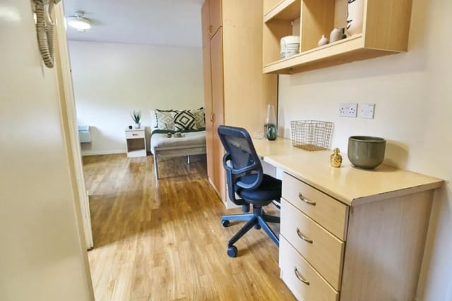 Desk chair bed dresser and shelf bedroom at Manchester Court in Manchester Student Accommodation