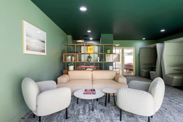 Sofa chairs tables artwork shelf living room at AXO Kingston in Kingston Upon Thames Student Accommodation