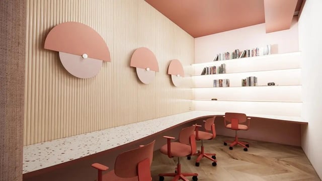 Orange chairs with desks and bookshelves study area at Bridge House - Glasgow in Glasgow Student Accommodation