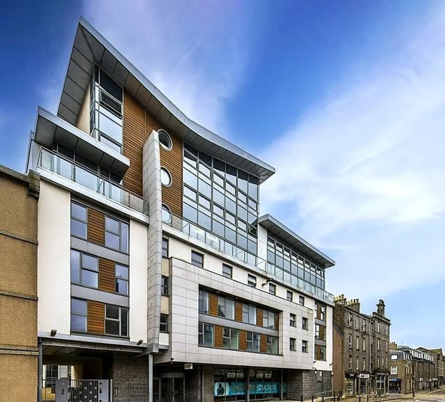 Modern building with glass windows balconies exterior at St. Andrew Street in Aberdeen Student Accommodation
