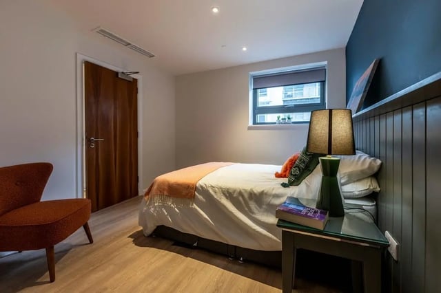 Bed chair door and window bedroom at St. Andrew Street in Aberdeen Student Accommodation