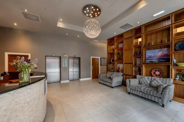 Lobby with sofas reception and elevators communal area at St. Andrew Street in Aberdeen Student Accommodation