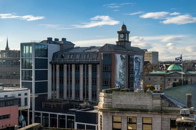Building with clock tower and murals exterior at St. Andrew Street in Aberdeen Student Accommodation