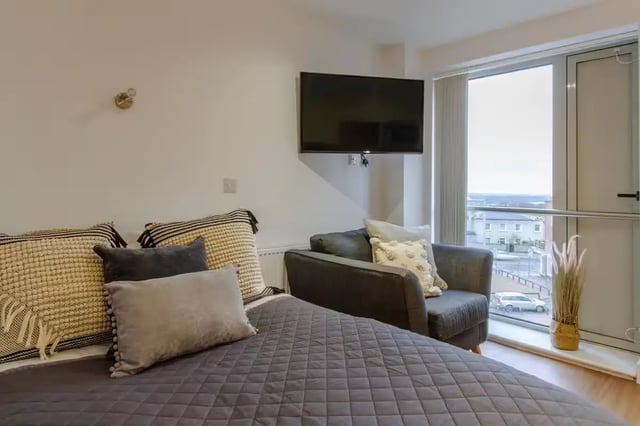 Bed sofa television window and exterior view bedroom at Orbital in Nottingham Student Accommodation