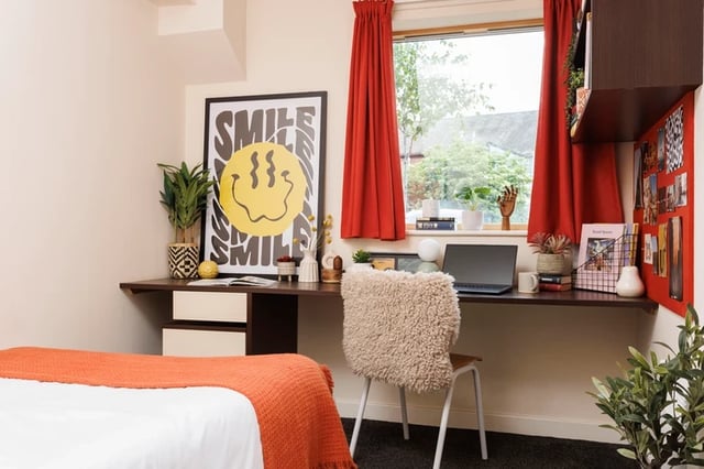 Desk chair laptop artwork bed study area bedroom at Byron Central in Newcastle Upon Tyne Student Accommodation