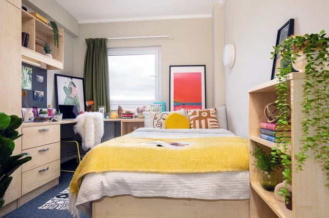 Bed desk and shelves student bedroom at James Watt in Birmingham Student Accommodation