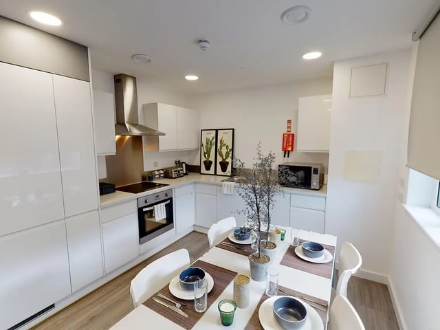 Modern kitchen with dining table and chairs kitchen at Canterbury Student Manor in Canterbury Student Accommodation