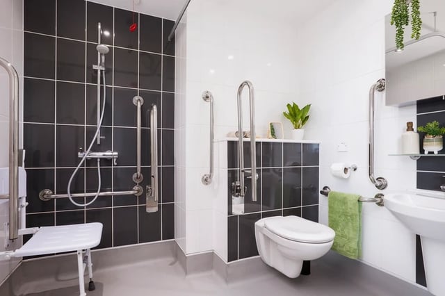 Accessible bathroom with shower seat toilet and sink bathroom at Battery Park in Birmingham Student Accommodation