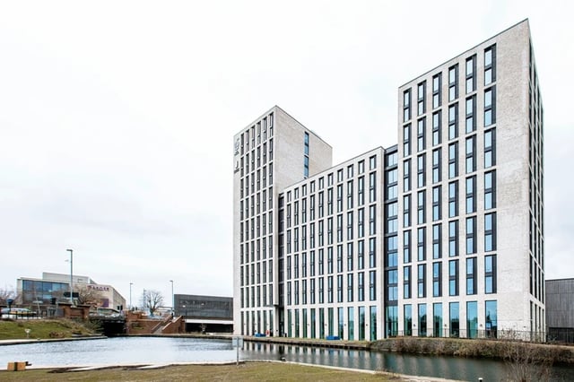 Modern apartment building exterior with water exterior at Battery Park in Birmingham Student Accommodation