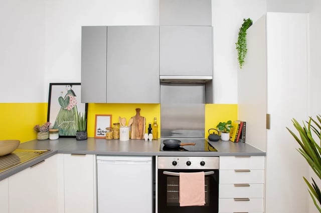 Kitchen with modern cabinets fridge oven and stovetop kitchen at Battery Park in Birmingham Student Accommodation