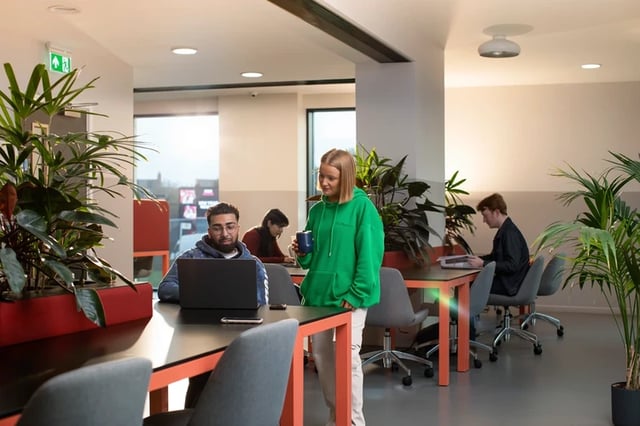 Students working at tables with laptops study area at Battery Park in Birmingham Student Accommodation